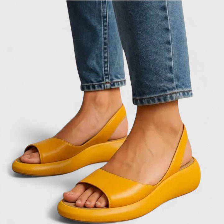 Orthopedic sandals featuring a cushioned insole and shock-absorbing sole, designed for comfortable slip-on summer wear. 0
